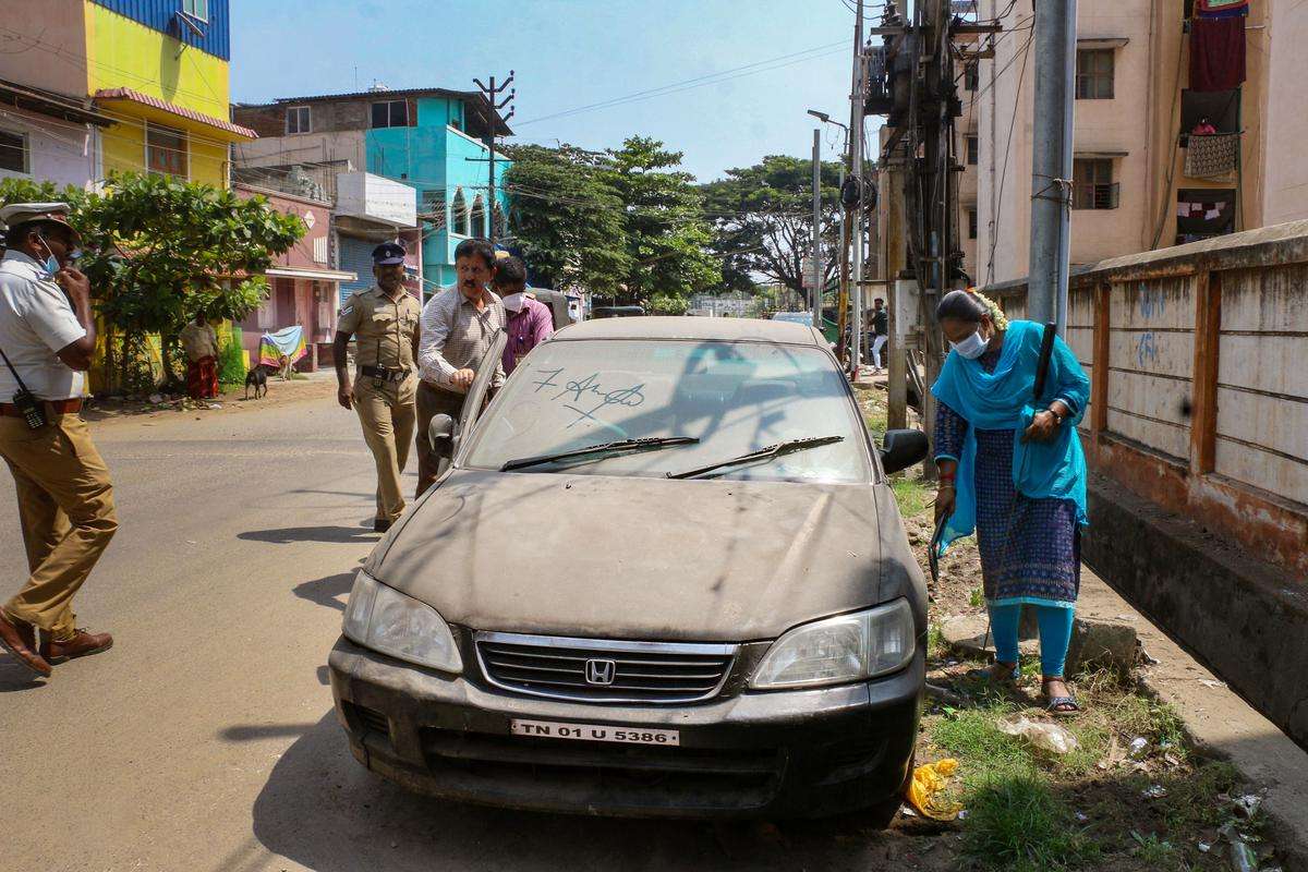 Security personnel checked a parked vehicle after an LPG cylinder exploded inside a car in Coimbatore.