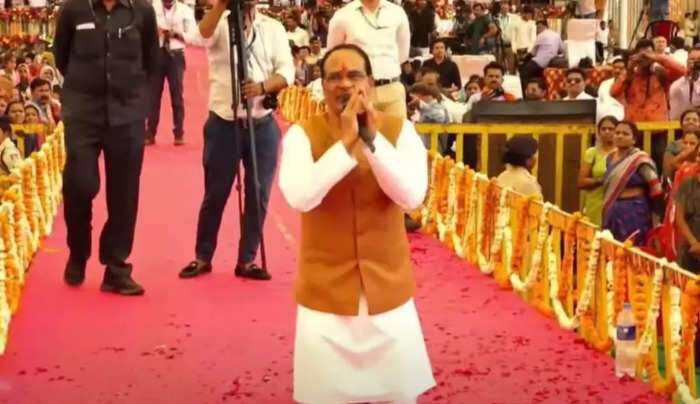 Read more about the article May God give all your problems to me: MP CM Shivraj Chouhan to women, sits on his knees